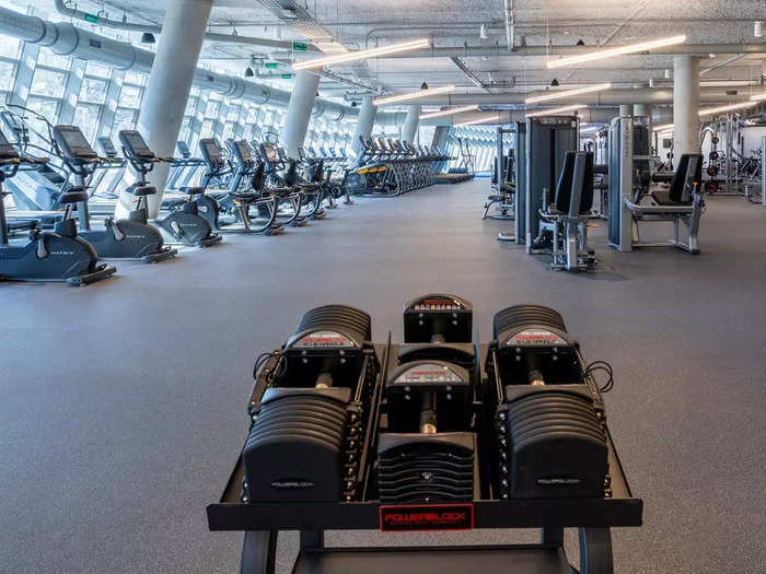 …a glamorous fitness center featuring 73,500 square feet of gym equipment, private group class rooms, and an outdoor exercise pool…