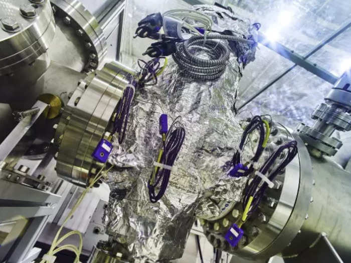 One of the final stages of antimatter production involves a vacuum, otherwise any antimatter would be annihilated when it contacts regular matter. This section of the vacuum chamber heats to around  250°C (482°F) to remove gas and water vapor, leaving a near-perfect vacuum in the middle of the chamber.