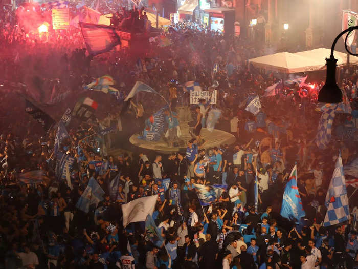 The fans could be seen climbing on anything that would hold them.