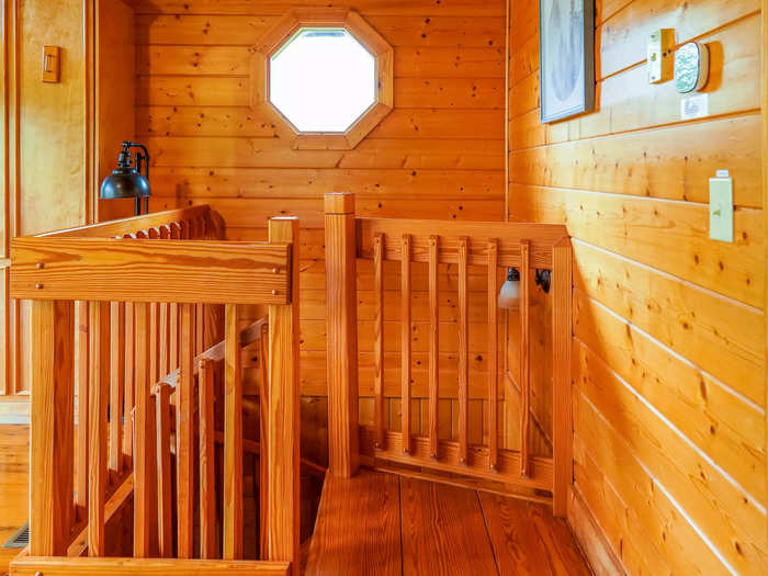 Back inside, a spiral staircase at the back corner of the living space led to the bedroom.