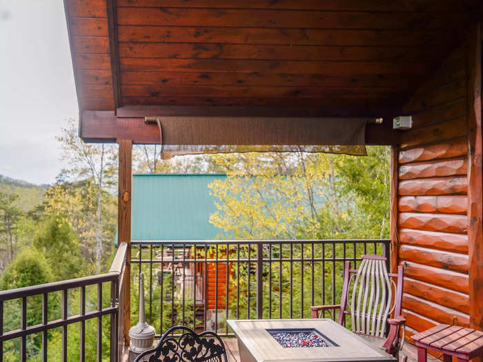 On the balcony, there was a variety of seating surrounding a propane firepit, from metal patio chairs to rocking chairs and a swing.