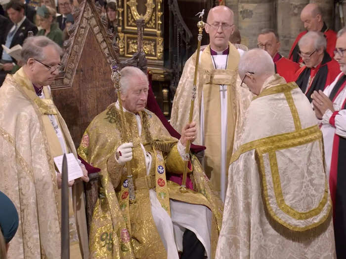 Charles then received royal regalia, including an orb and sceptre.