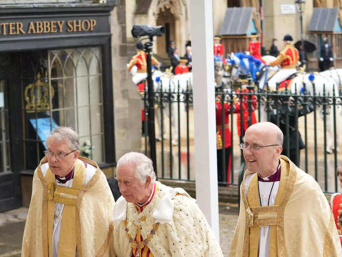 King Charles offered a brief smile as he entered Westminster Abbey ahead of his coronation ceremony, but his expression turned stoic as he walked inside.