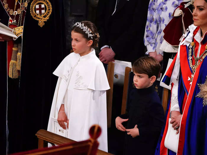 The youngest of the Wales siblings had a dazed look on his face as he stood for a portion of the ceremony.