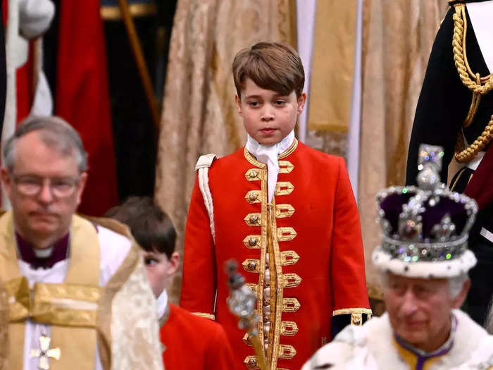 As Charles left Westminster Abbey, George carried the train of his grandfather