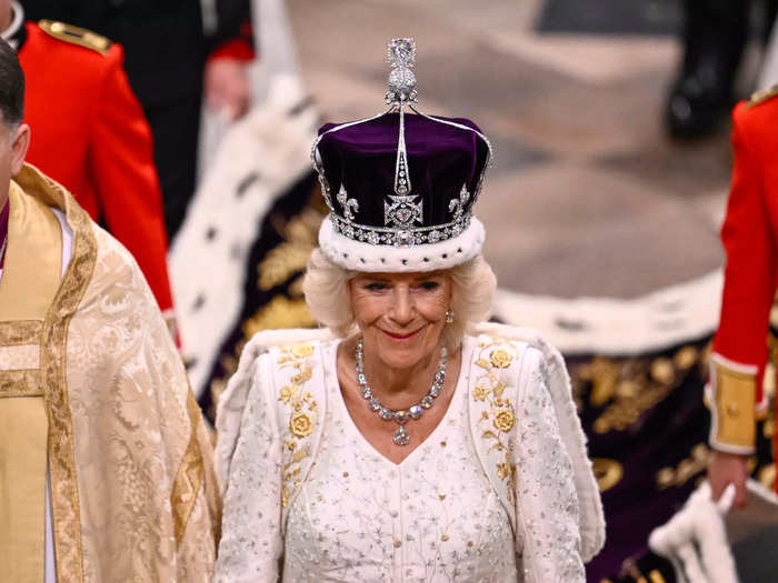 The new queen grinned proudly after the ceremony, looking at ease with the crown on her head.