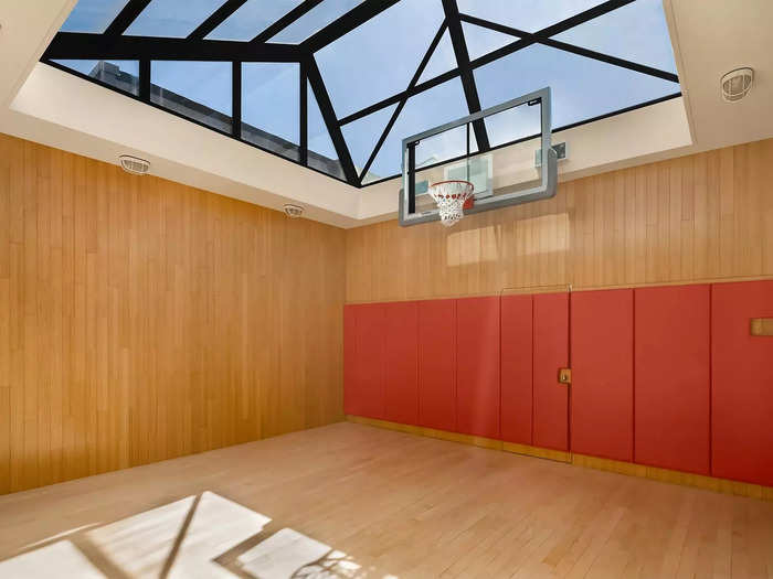 The property also features a roof-top mini basketball court with a skylight and a home gym.