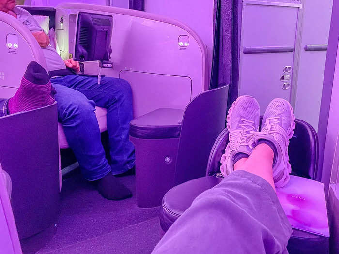 As far as planes go, my business-class seat was massive. Beyond two armrests, I had a large TV screen, an even larger tray table, and a footrest with enough space to stretch out both my legs comfortably.