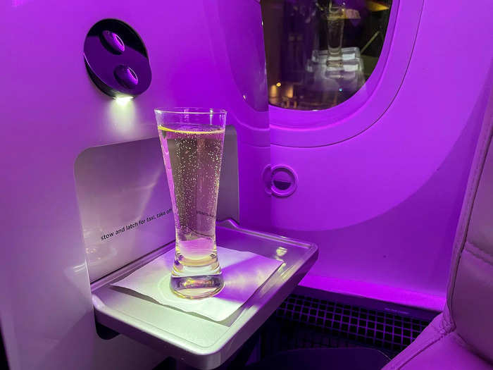 I stepped onto a nearly empty plane and had a short walk to my seat. And after getting settled, a flight attendant offered me a glass of Champagne.