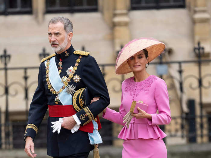 Representing Spain, King Felipe wore a formal military suit while Queen Letizia opted for a bubblegum pink Carolina Herrera look.