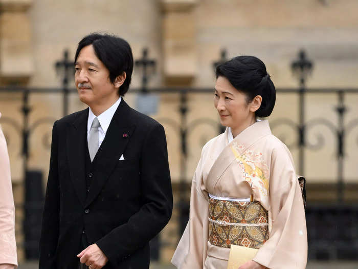 Crown Prince Akishino of Japan wore a morning suit while his wife, Crown Princess Kiko, opted for a beige kimono.