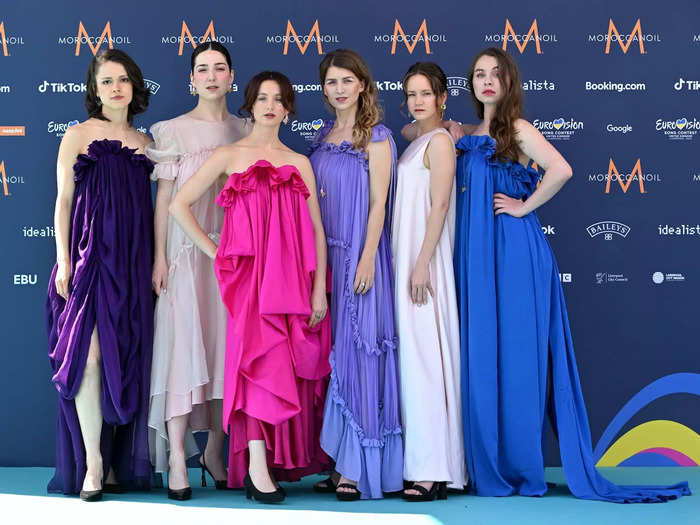 Each member of Vesna, a folk band from Czechia, wore a flowing gown in different shades of pink, purple, and blue.