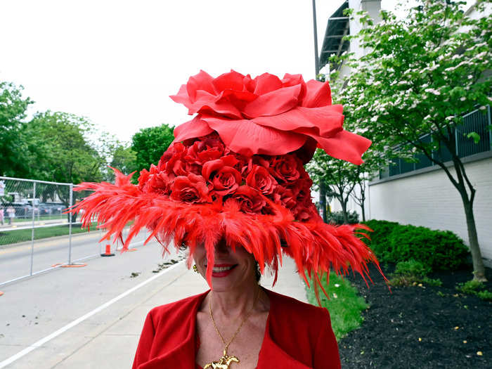 The popular rose motif was taken to the next level with this bright-red, feather-lined hat topped with a gigantic flower.