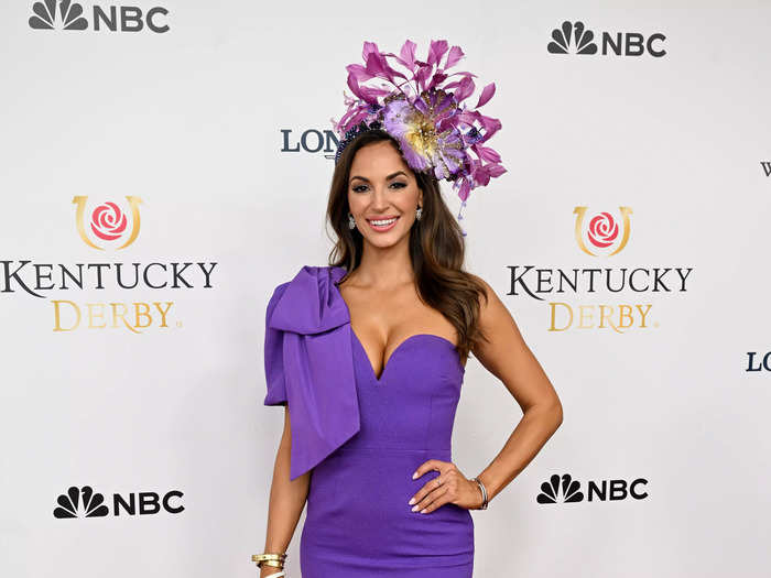 Model Maria Montgomery paired her hat — which stood out with an oversized flower — with a purple dress of a similar hue.