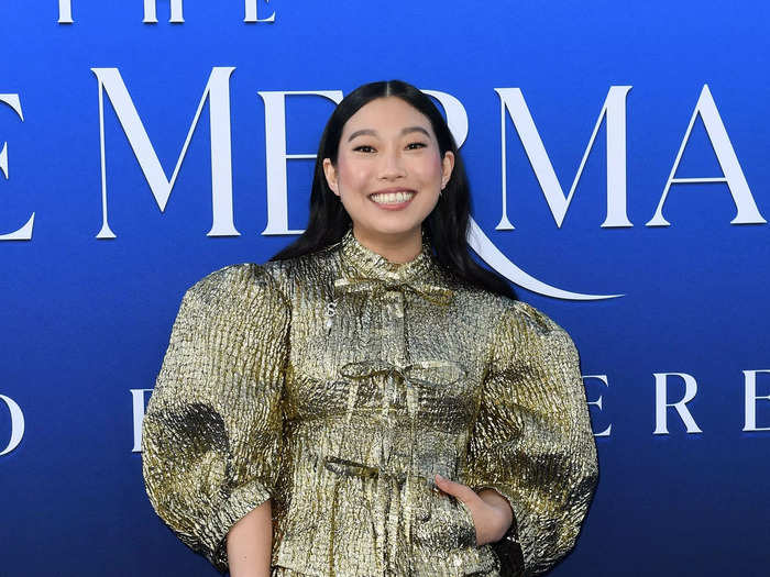 Scuttle voice actor Awkwafina was all smiles while in a gold dress and boots.