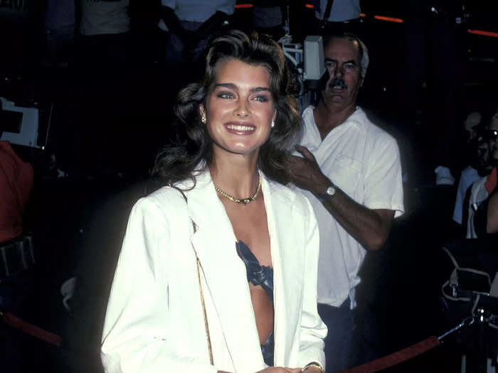 Brooke Shields wore an open blazer over a revealing blue bodysuit in 1983.