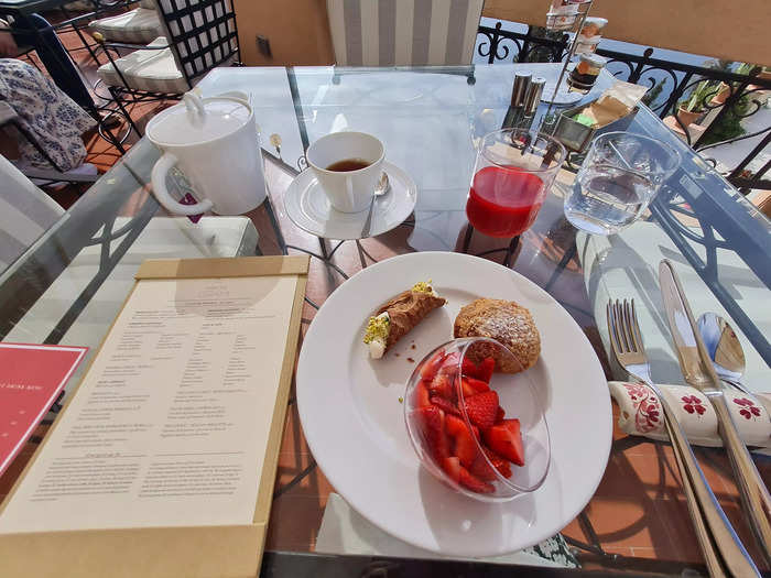 In addition to my cannoli, I had a bowl of strawberries, a vanilla pastry, blood-orange juice, and a cup of tea.