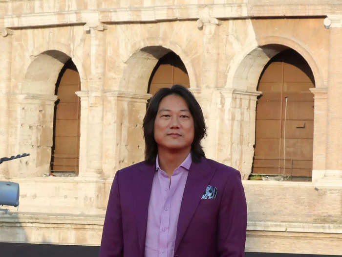 Sung Kang added a pop of color to the red carpet in a mauve suit.