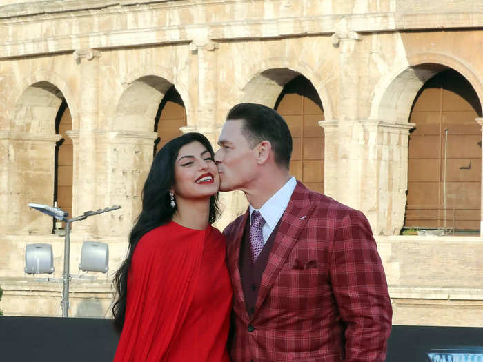 John Cena and Shay Shariatzadeh coordinated in scarlet ensembles.