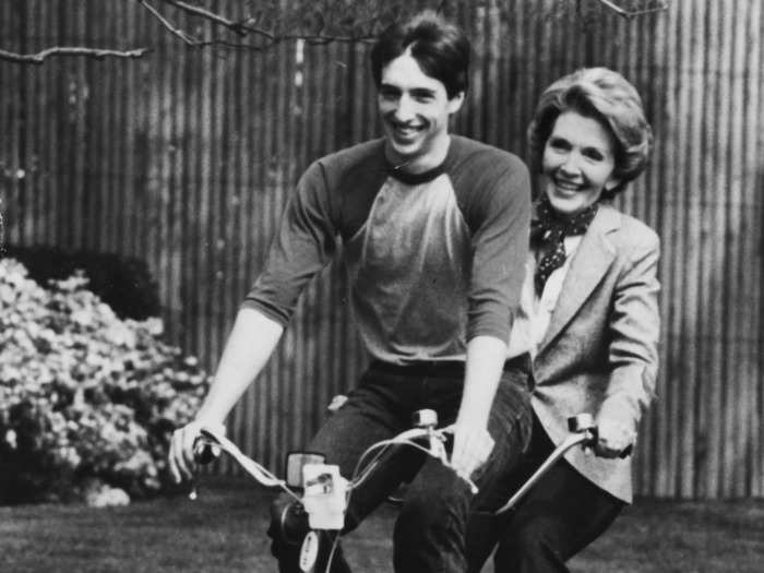 Nancy Reagan rode a tandem bike with her son, Ron Jr., on the south grounds of the White House in 1981.