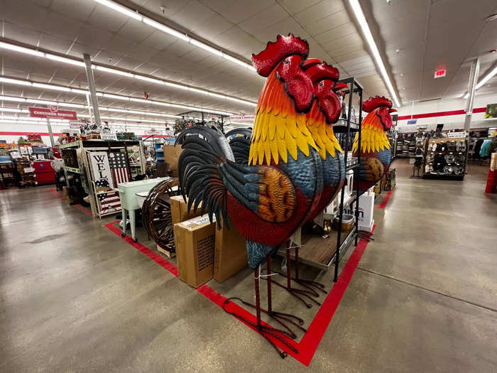 The center of the sales floor features a rotation of seasonal items and decor like these jumbo decorative roosters...