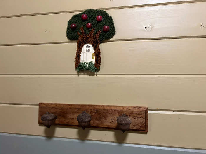 I loved all the details throughout the space, from the acorn-shaped coat hooks to the small tree house on the wall.