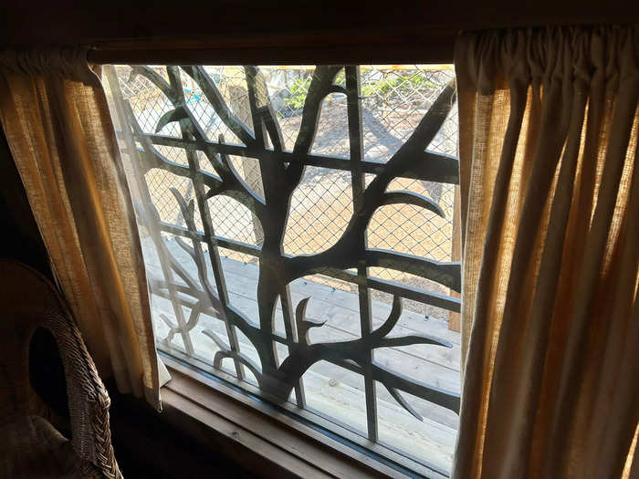 I loved the branch-inspired designs decorating some of the windows — they made the house feel like it was surrounded by trees.