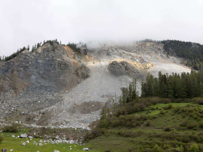 Swiss authorities say about 2 million cubic meters of rock on an Alpine mountainside overhead could soon come crashing down.