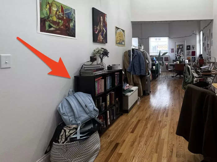 Out from the living room is the hallway, where she said we could take advantage of our high ceilings by adding taller bookshelves.