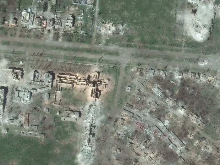 The university and surrounding buildings are now nearly unrecognizable. The buildings, now skeletal, have been devastated in the war. The radio tower now lays on its side.