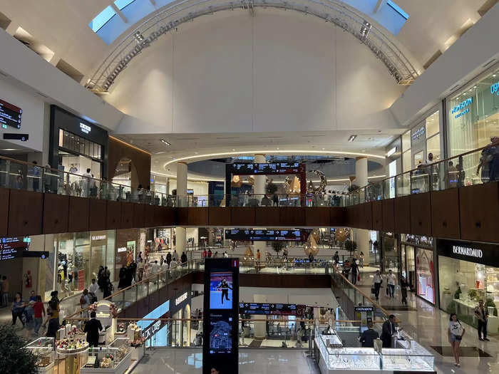 Dubai Mall is like an indoor city with 1,200 stores, an ice rink, an aquarium, a virtual-reality park, a dinosaur skeleton, and a 26-screen cinema.