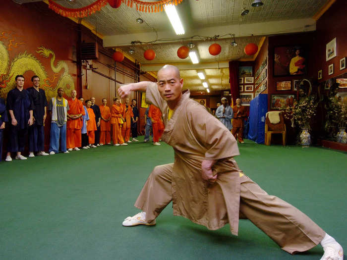 In 1992, Shi was touring the US with a select group of Shaolin monks when he defected from China, sneaking out of his hotel at night and escaping to New York. Shi said his defection was motivated in part because he disagreed with the monastery