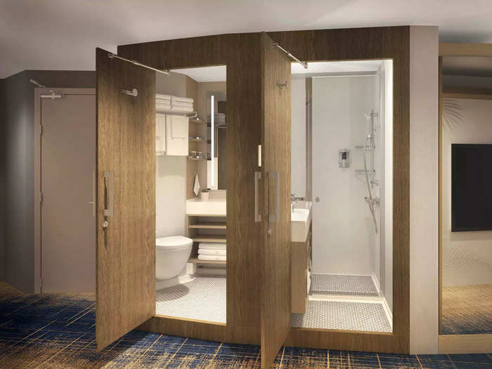 Past this alcove, the two-part bathroom is also unique to the stateroom.