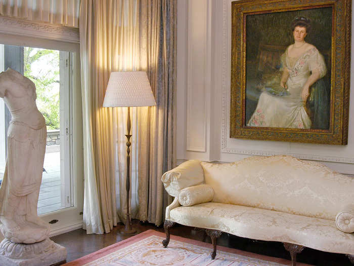 A portrait of Abby Rockefeller, the wife of John D. Rockefeller Jr., hung in the Alcove with standing lamps designed by 20th-century Swiss sculptors the Giacometti brothers.