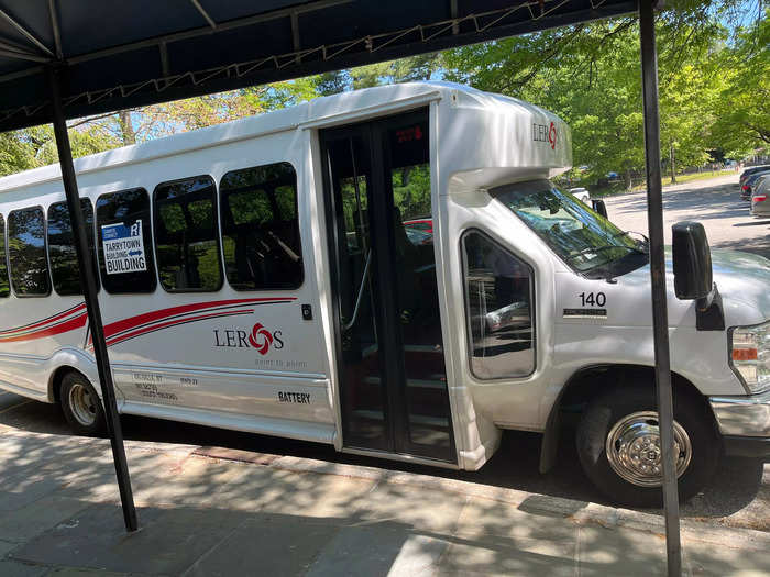 A shuttle bus transports tour groups from the Visitors Center to the mansion — it