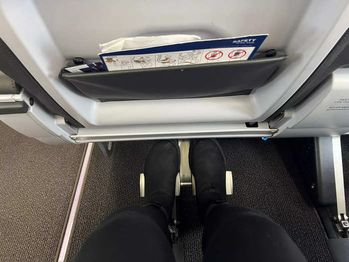 Like with my first international flight, my Saga Premium seat had plenty of legroom and a metal footrest. My tote bag still didn