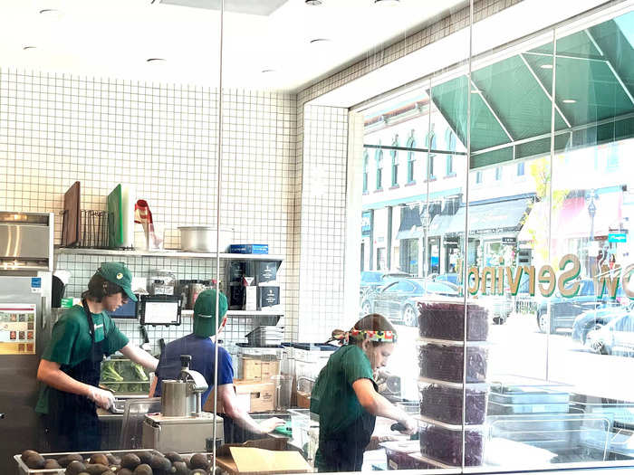 Despite the autonomous nature of the wildly impressive Infinite Kitchen, human labor was still crucial for the operation. I spotted employees preparing ingredients, same as any other Sweetgreen. There was also someone monitoring the ordering kiosks, offering assistance and even handing out samples.