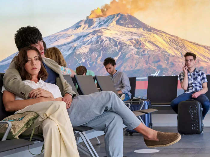 Mount Etna, an active volcano in Sicily, is shown in the background of many scenes, including this shot of Harper and Ethan waiting at the airport in the season finale.