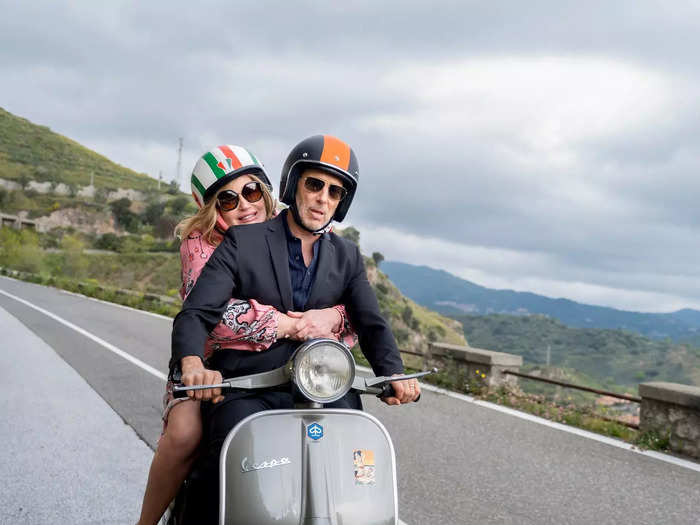 The hotel is located in Taormina, a hilltop town on the east coast of Sicily, where Tanya and Greg ride around on a Vespa.