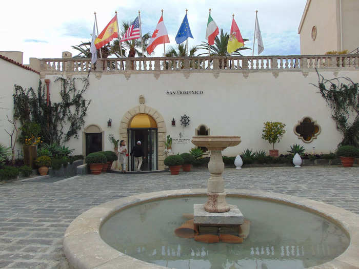 The exterior appeared to be unchanged in real life, sharing many of the same features including the fountain and the plants.