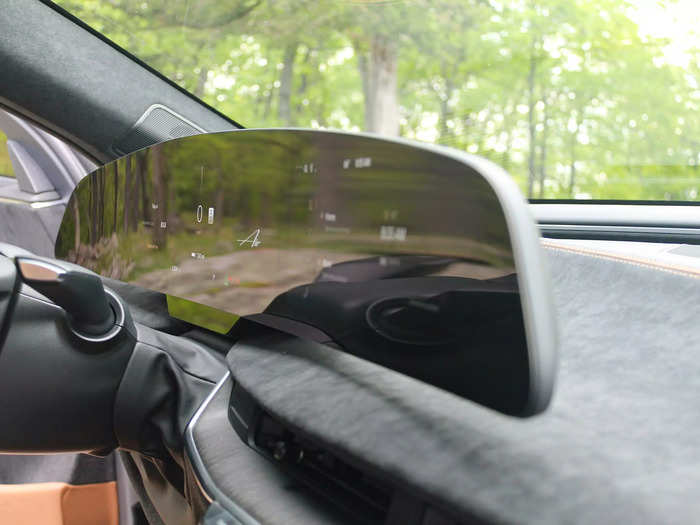 The 34-inch cluster of three screens behind the steering wheel almost looks like it