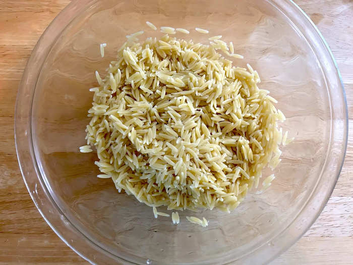 Once the orzo was al dente, I drained it and transferred my pasta to a large bowl.