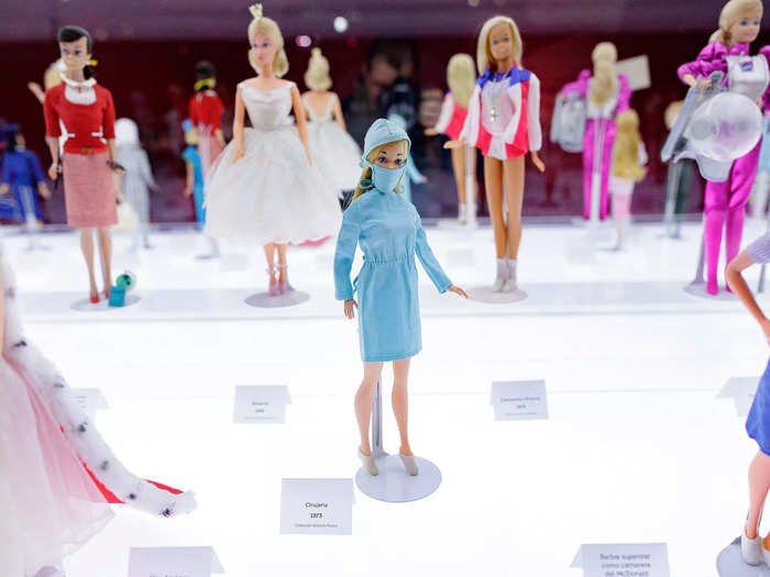 Soon, Barbie was appearing in more serious roles. She was a pilot, a surgeon, or a CEO. But other Barbies still came with mini domestic machinery, like washing machines and dryers.