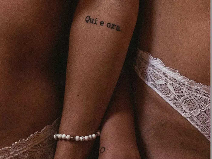 This tattoo means "here and now."