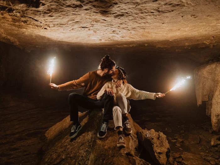 The images show incredible locations around the world. These adventurous fiancés brought sparklers into a cave for their engagement photos.