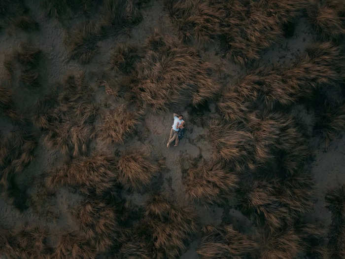 Meanwhile, a happy couple hides from the world in this powerful aerial photo.