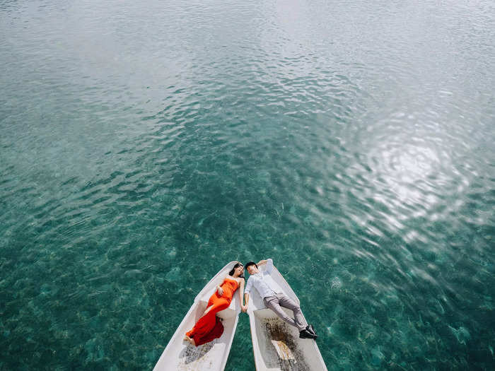 Some of the most stunning engagement photos capture couples on the water. This couple, shown in Bali, look like they