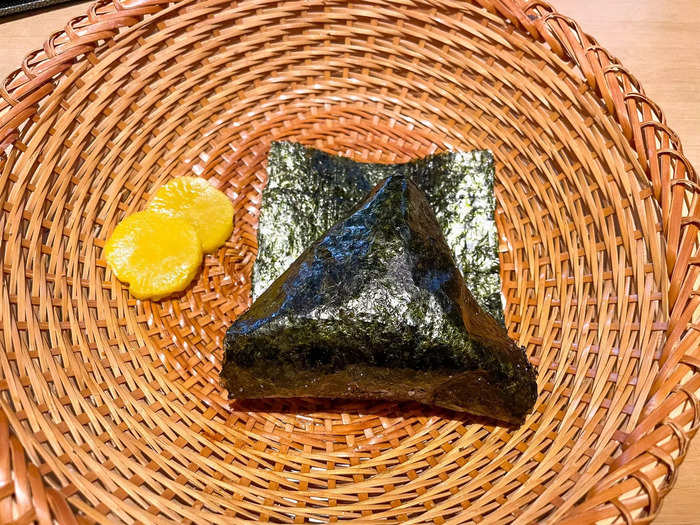 Within minutes of placing my order, a bamboo basket with my first onigiri was placed on my table. The onigiri is served one at a time so the seaweed can stay fresh and crisp, I learned.