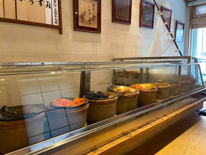 At the bar, a glass case displayed all the onigiri fillings.