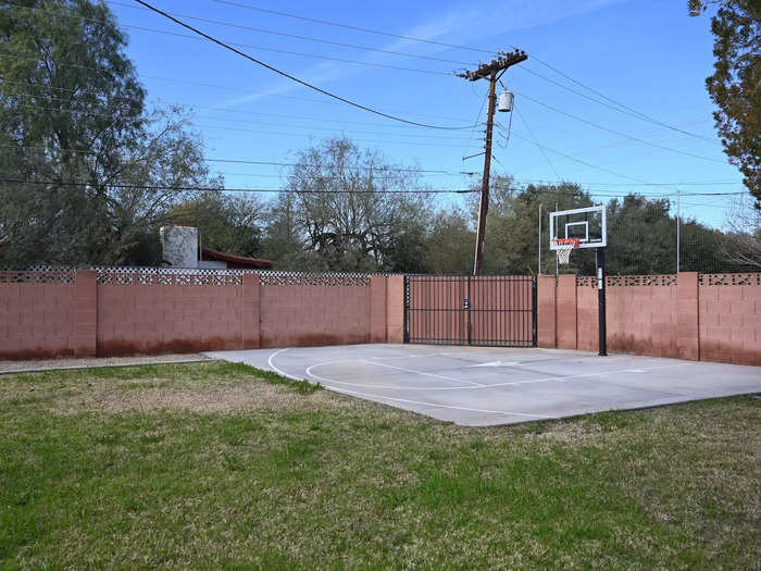 One side of the yard was originally home to a basketball court, but Aguirre decided to turn it into an additional lounge space for guests.